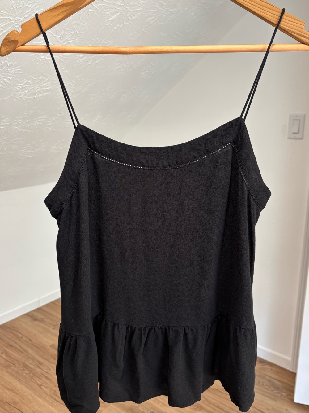 Loft black eyelet camisole with peplum waist, lightweight and flowy. Size small